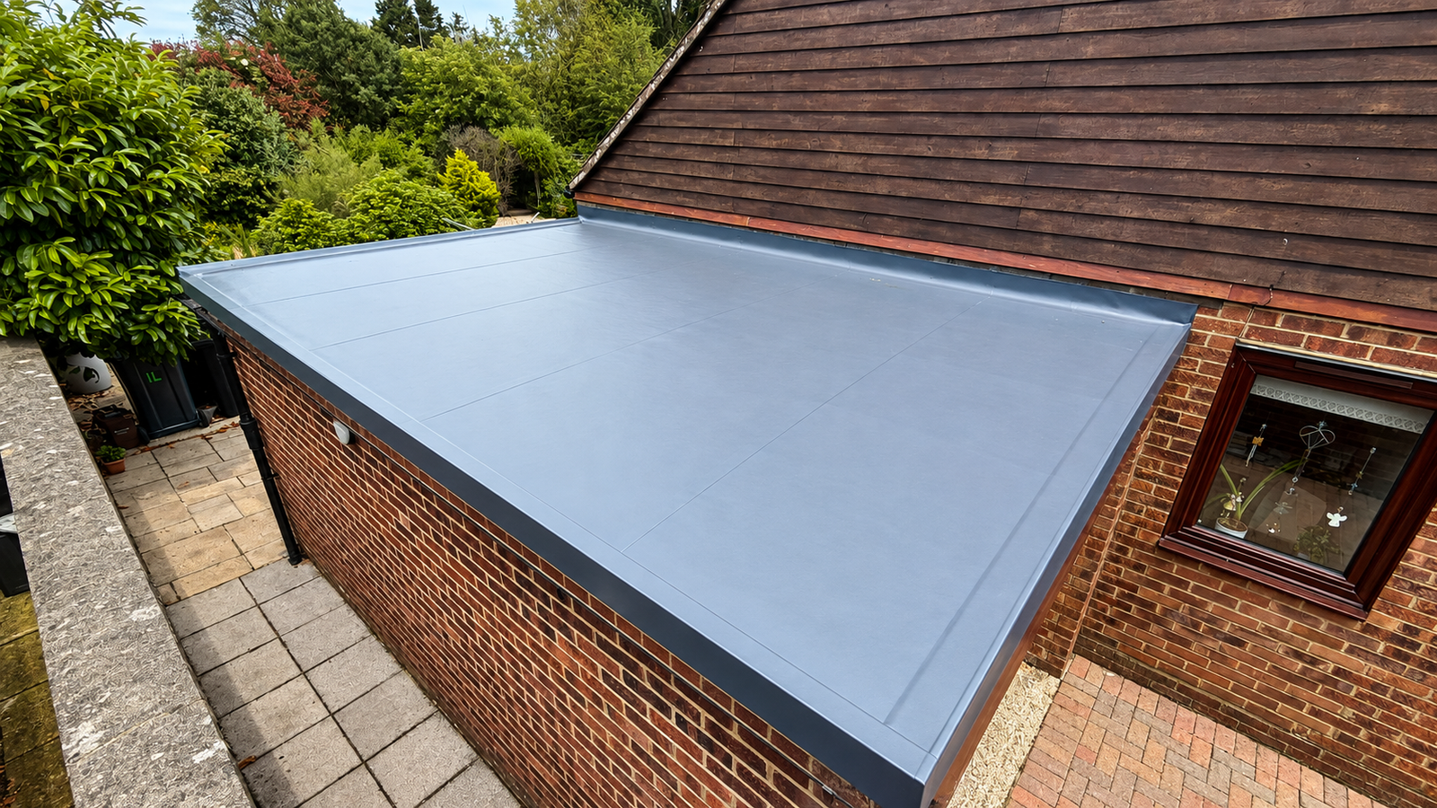Flat roof overlay on a porch and garage in Fordingbridge